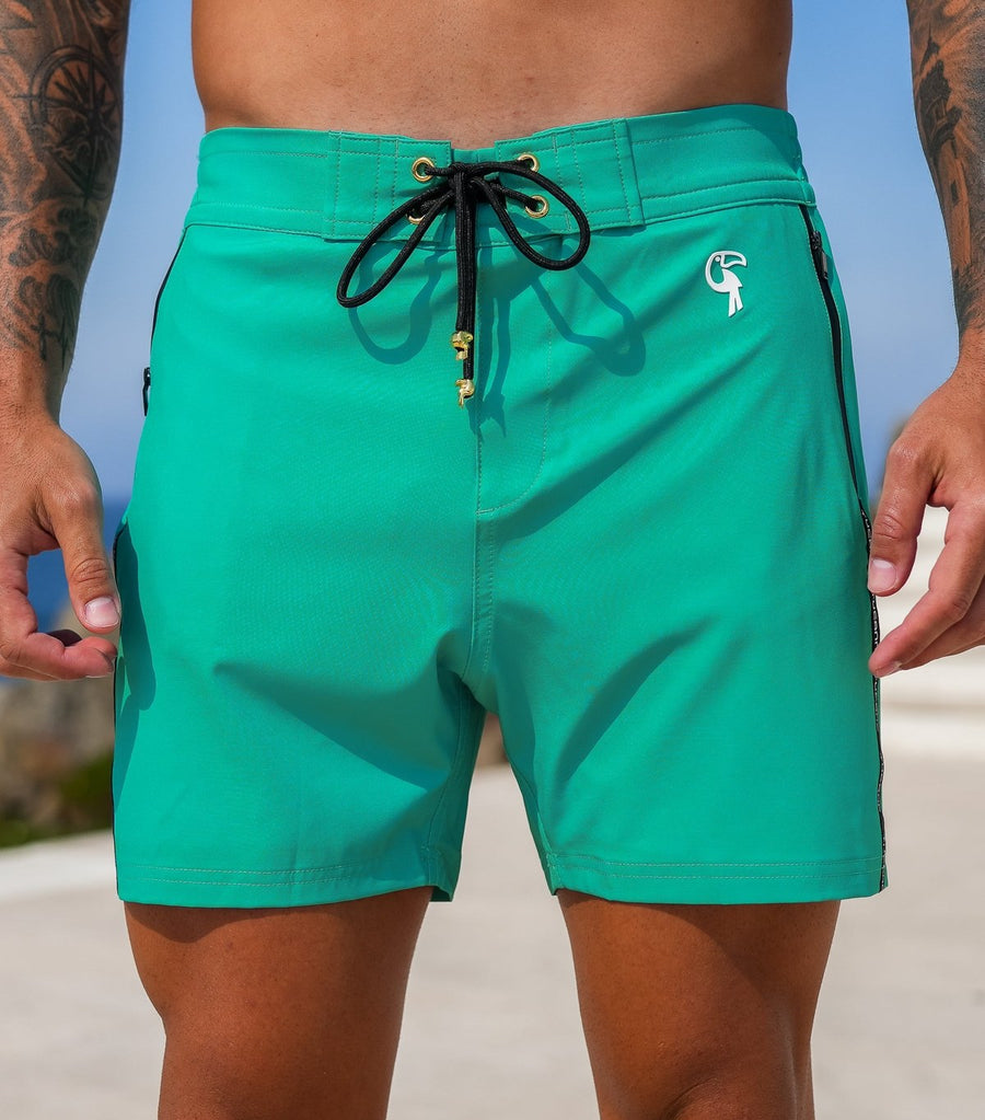 Signature Mint 5" swim trunks on model