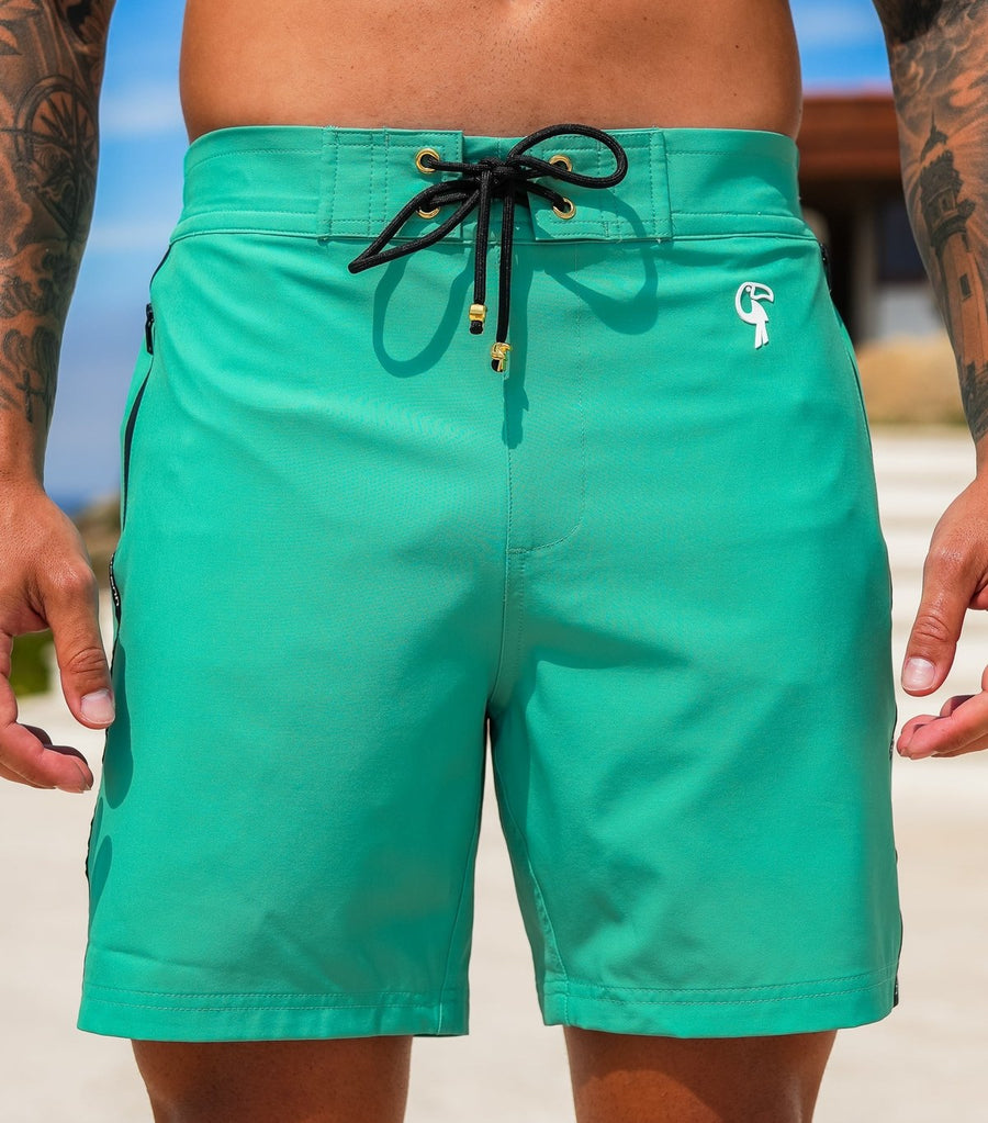 Signature Mint 7" swim trunks on model