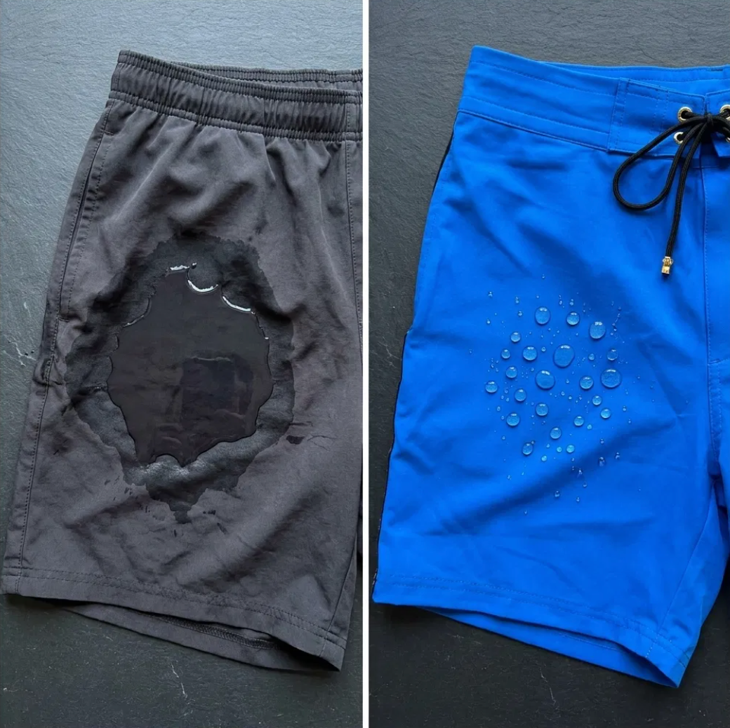 Water soaking into conventional running shorts beside water beading on Tucann fabric